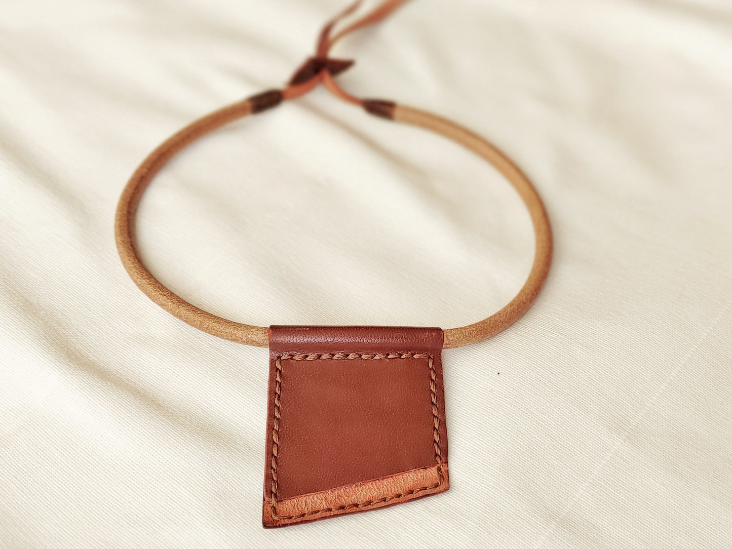 Geometric minimalist necklace made of brown leather