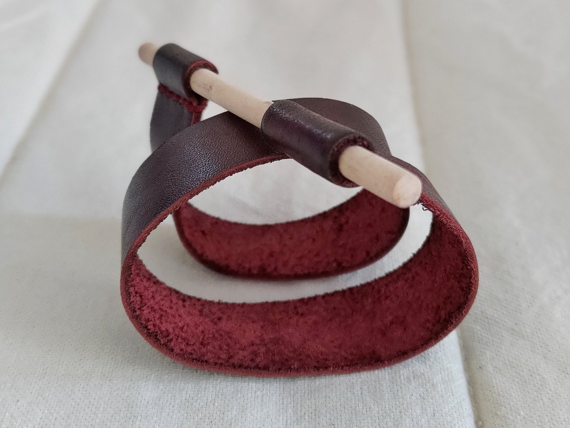 Red leather wrap around bracelet with wooden pin closure