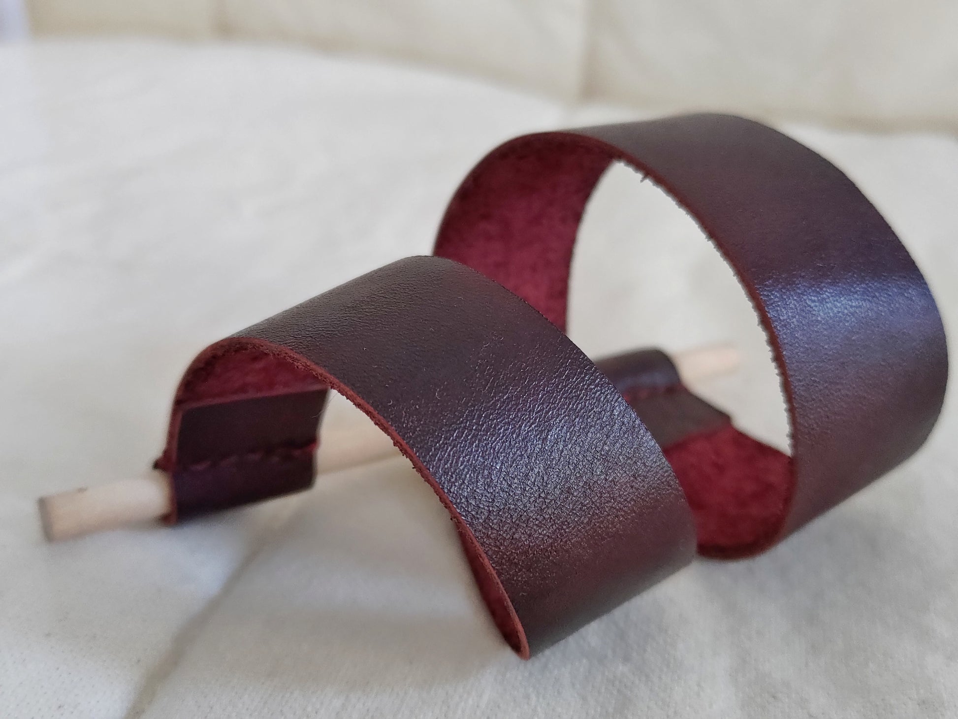 Red leather wrap around bracelet with wooden pin closure