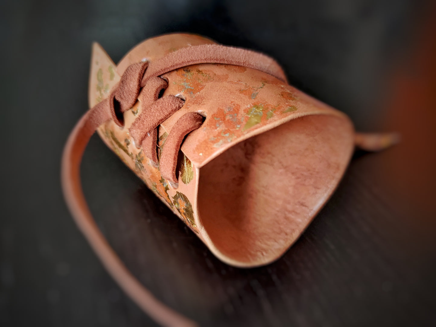 Tan leather bracelet with gold decoration